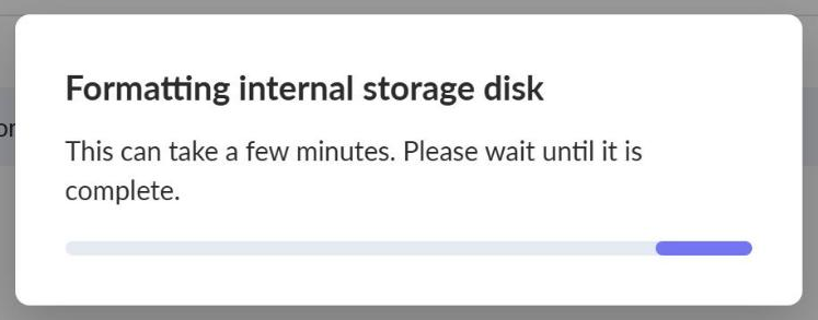 The Internal Music Storage card showing a progress bar while the drive formats